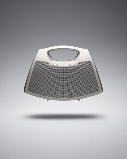 A silver bag with speaker holes on the front