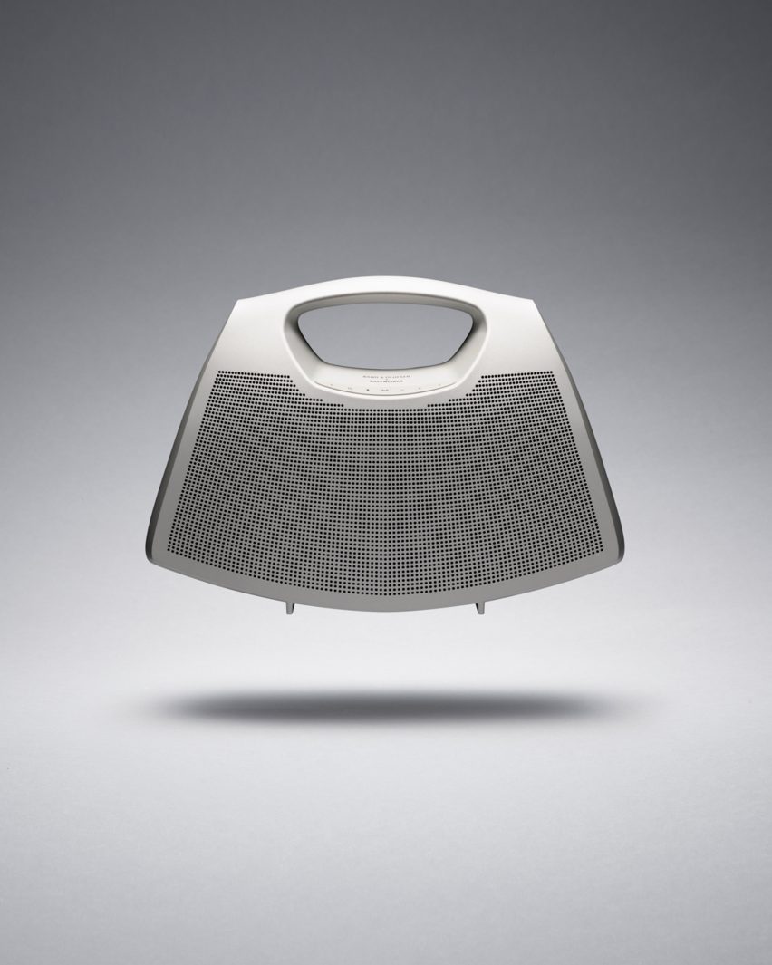A silver bag with speaker holes on the front