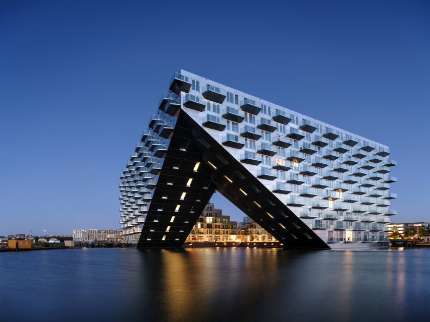 Sluishuis housing block by BIG and Barcode Architects cantilevered over IJ lake