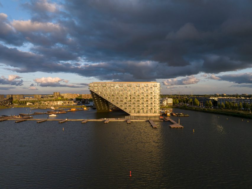 Sluishuis housing block by BIG and Barcode Architects cantilevered over IJ lake