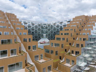 Sluishuis housing block by BIG and Barcode Architects cantilevered over IJ lake