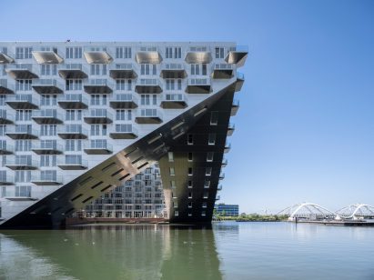 Sluishuis housing block by BIG and Barcode Architects cantilevered over IJ lake