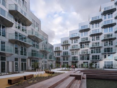 Sluishuis housing block by BIG and Barcode Architects cantilevered over IJ lake