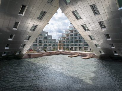 Sluishuis housing block by BIG and Barcode Architects cantilevered over IJ lake