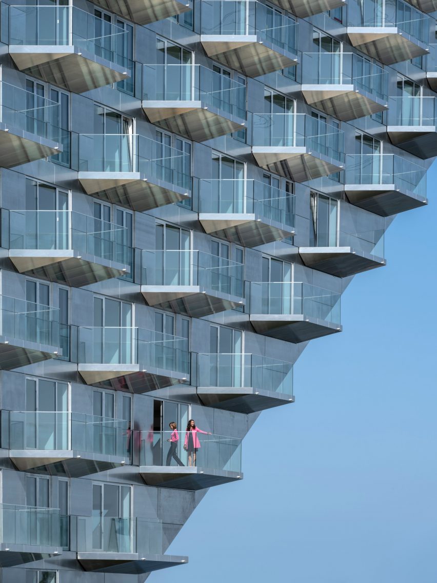 Sluishuis housing block by BIG and Barcode Architects cantilevered over IJ lake