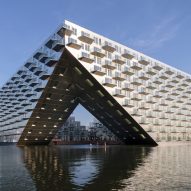 Sluishuis housing block by BIG and Barcode Architects cantilevered over IJ lake