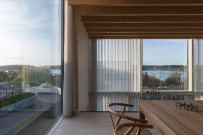 Dining room of Swedish villa overlooking sea
