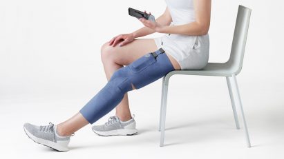 Person wearing blue Cionic Neural Sleeve on their leg