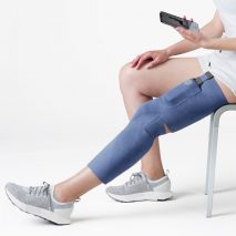 Person wearing blue Cionic Neural Sleeve on their leg
