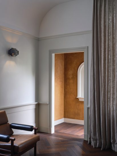 View from living room into hallway with brown paint in Home Dijkhuis