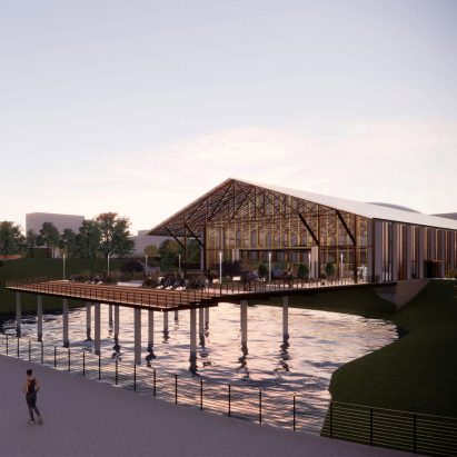 A pitched roof building on stilts over water