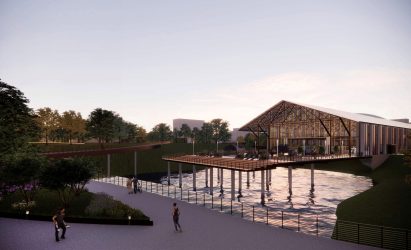 A pitched roof building on stilts over water