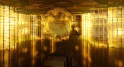 Interior space with glass walls illuminated by yellow light by student at Drexel University