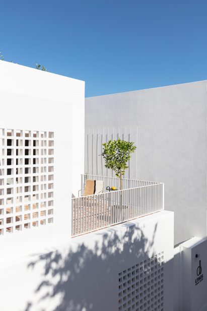 A cubist-style white building in Santorini
