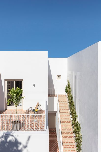 View of the hotel's stairs and terrace, which are paved with terracotta tiles