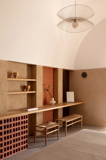 The room features a desk, shelving and chairs
