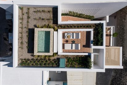 Aerial view of the hotel, including pool, terrace and herb garden