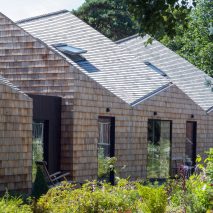 Exterior of angular house with garden in front