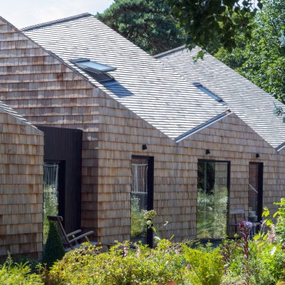 Exterior of angular house with garden in front