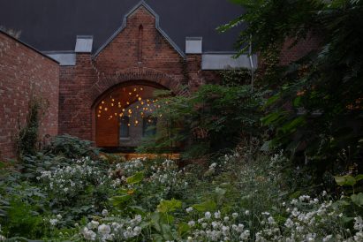 Lovis restaurant at Hotel Wilmina with small overgrown garden