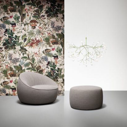 Green Heracleum Suspended light above grey seat and foot stool