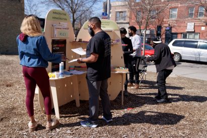 MDF pop-up with leaflets on a street-side