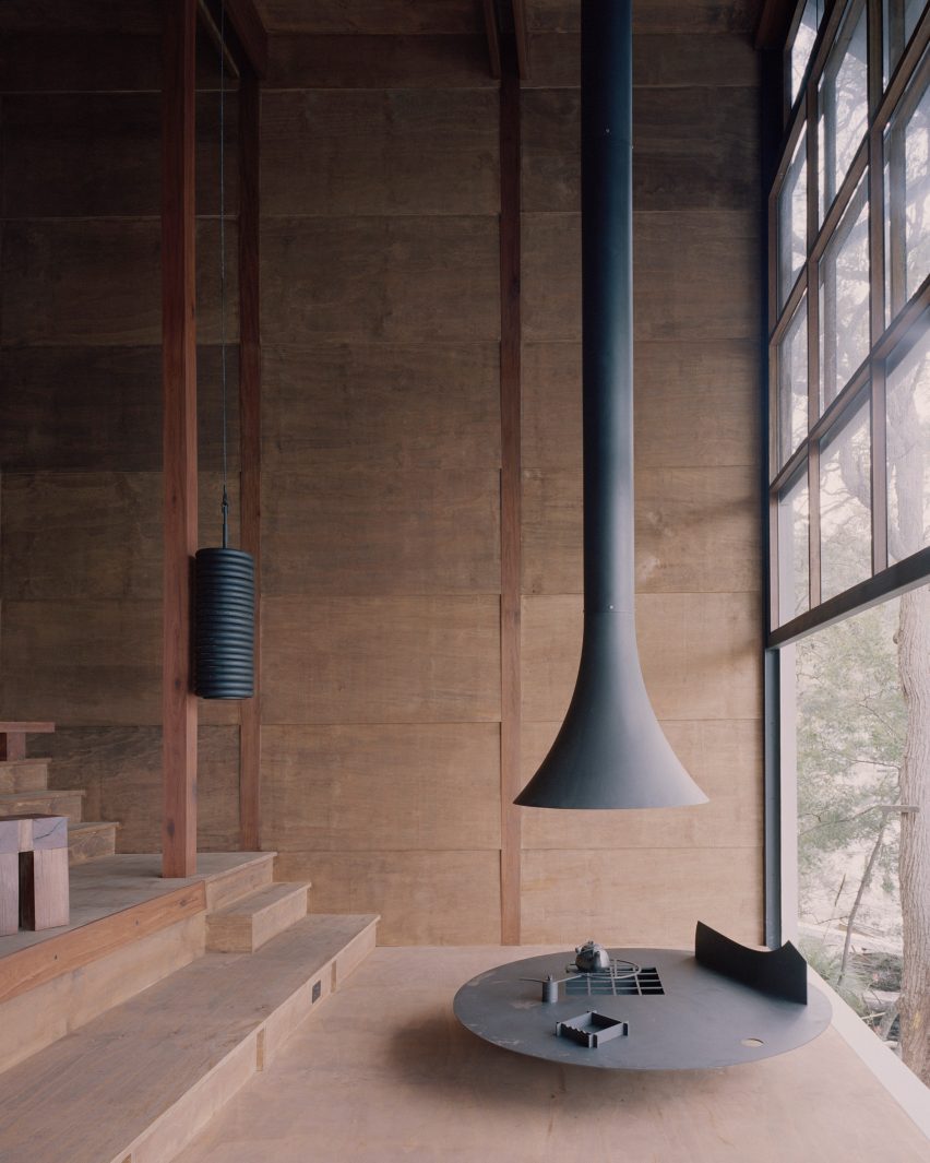 Suspended fireplace in a wooden interior