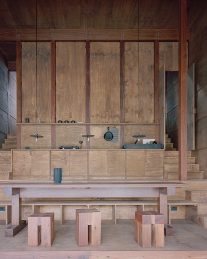 Interior image of the wood-lined living area at Marramarra Shack