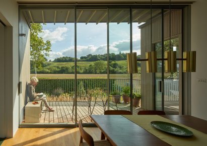 Kitchen and terrace of March House by Knox Bhavan