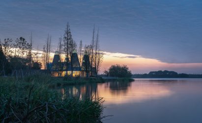 Exterior of Metasequoia Grove Restaurant by GOA across lake in China