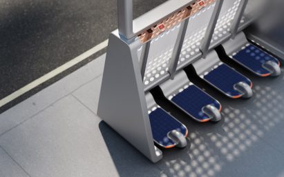 Close up of three-wheeled e-scooters tucked into the frame of the bus shelter