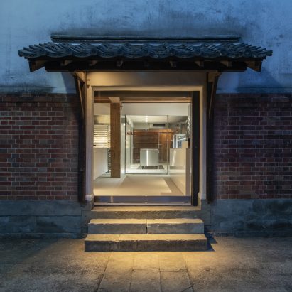 Photograph showing a pagoda-style entryway at nighttime