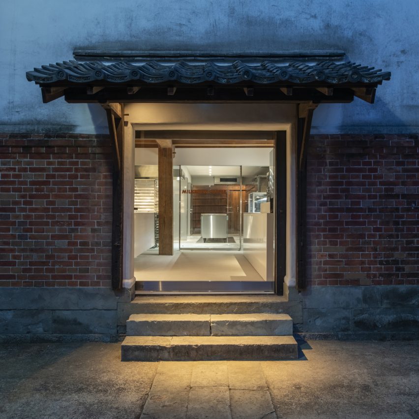 Photograph showing a pagoda-style entryway at nighttime