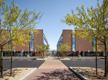 Courtyard between the buildings with trees and parking lot