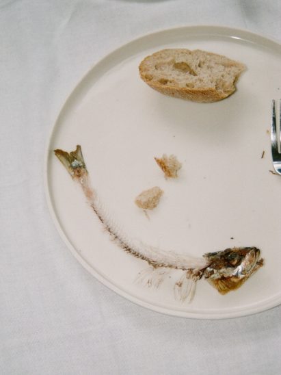 Large white Fish and Chips main plate part with food scraps on it