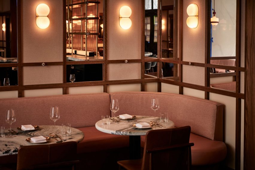 Banquette with mirrored panels above