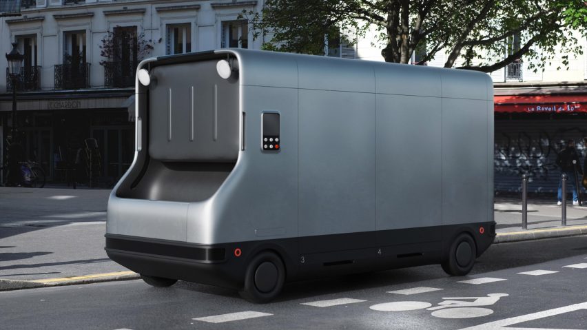 A silver autonomous and electric refuse-management truck on a street in Paris