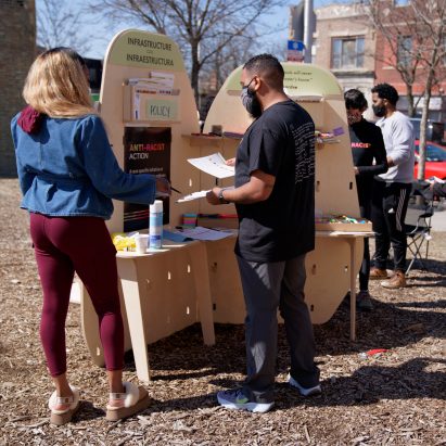 MDF pop-up with leaflets on a street-side