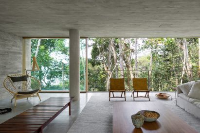 Interior of the first floor of Casa Azul with views to the rainforest trees