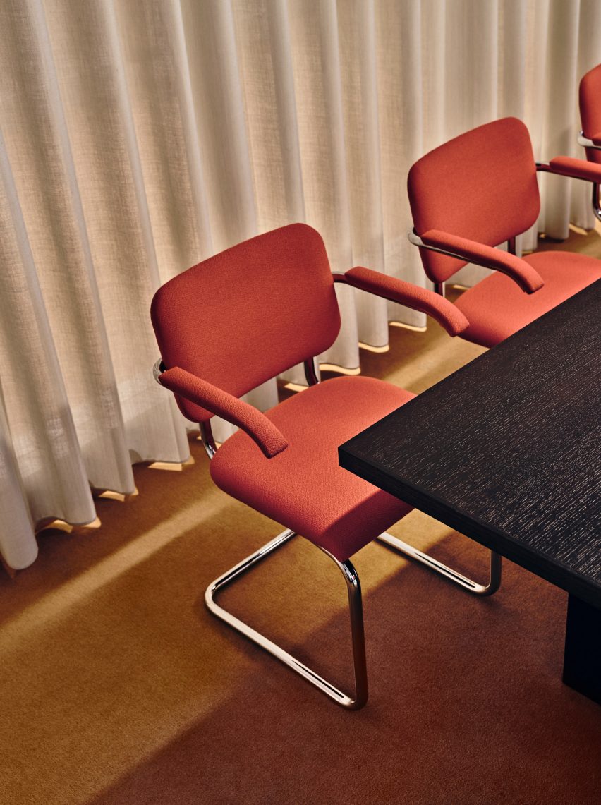 Red chairs in TOG at Borough Yards by Studio David Thulstrup