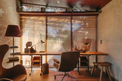A hotel study area with warm brown tones