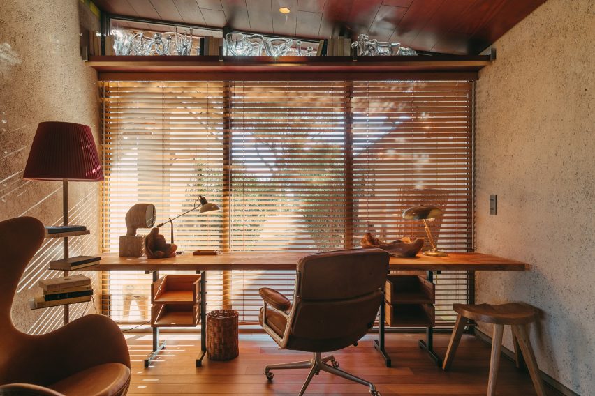A hotel study area with warm brown tones
