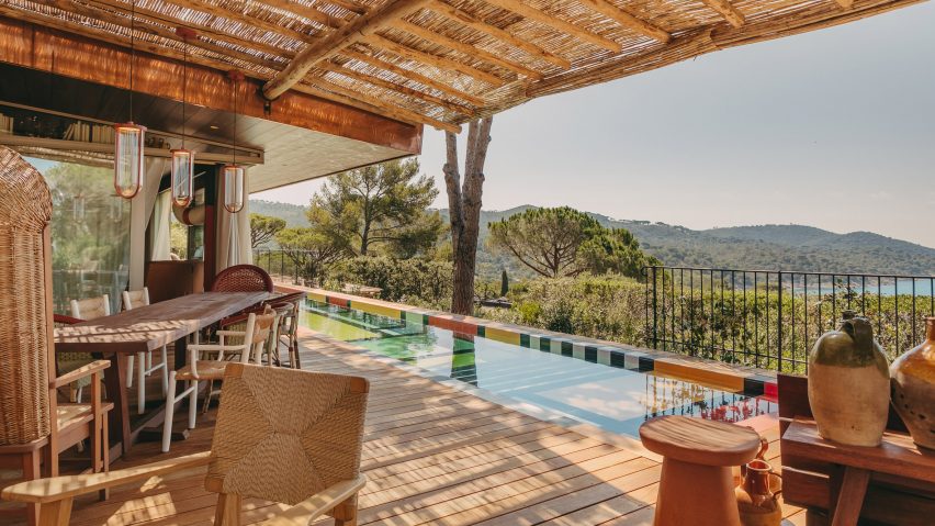 A decked terrace and swimming pool