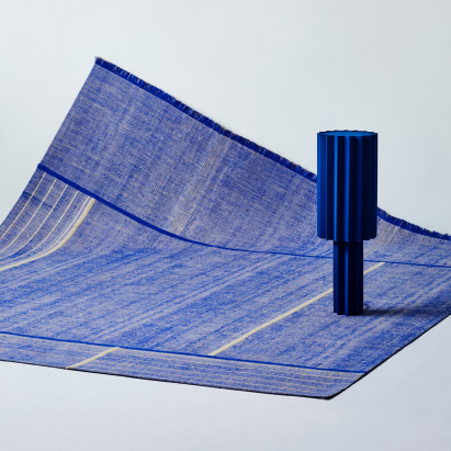 Image of blue object on top of blue tapestry