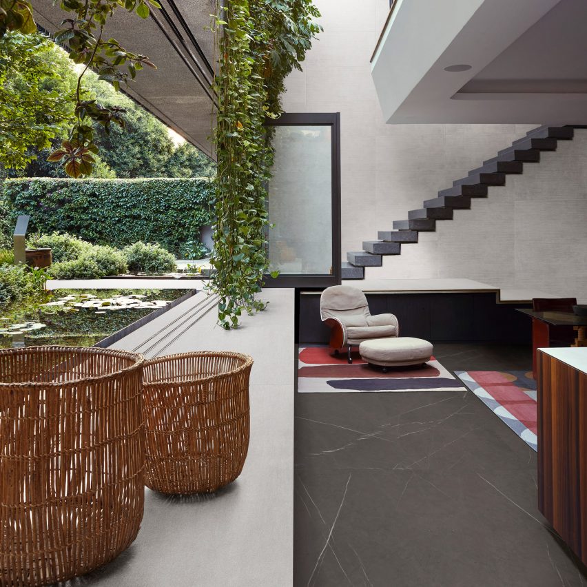 Plant-filled apartment featuring Marazzi grey tiles