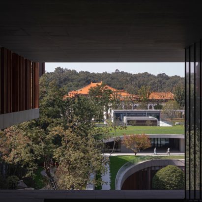 A photograph of the outside of a building with a red rooftop