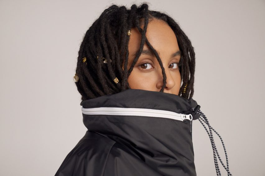 A woman wearing an Adidas jacket