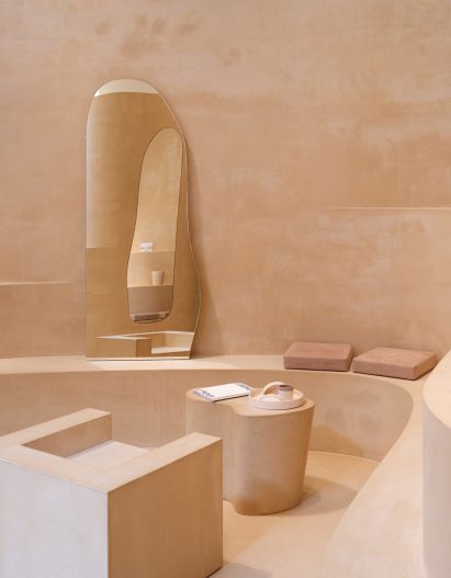 Interior image of a clay-clad seating area 