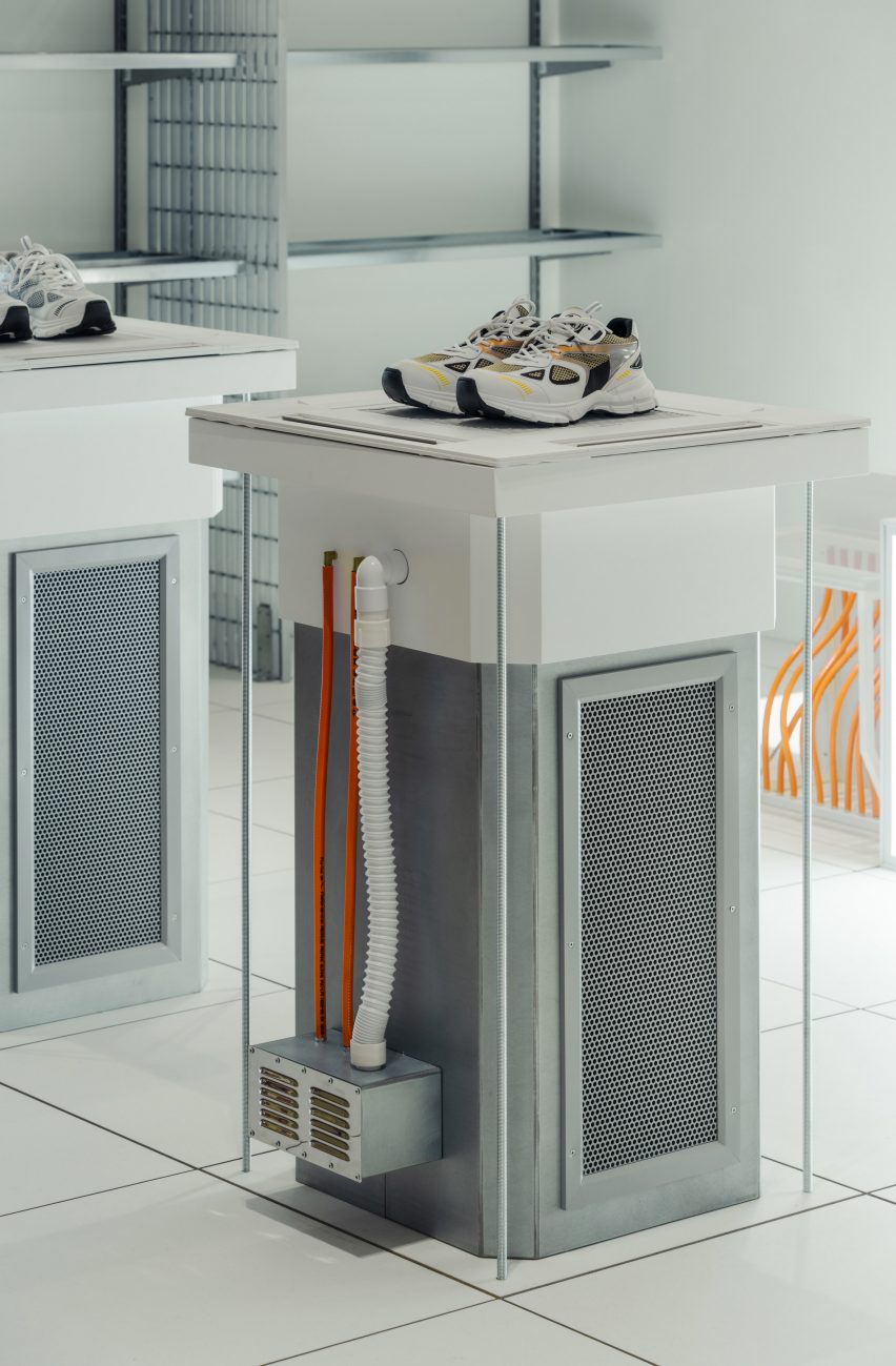 Image of trainers displayed on a plinth