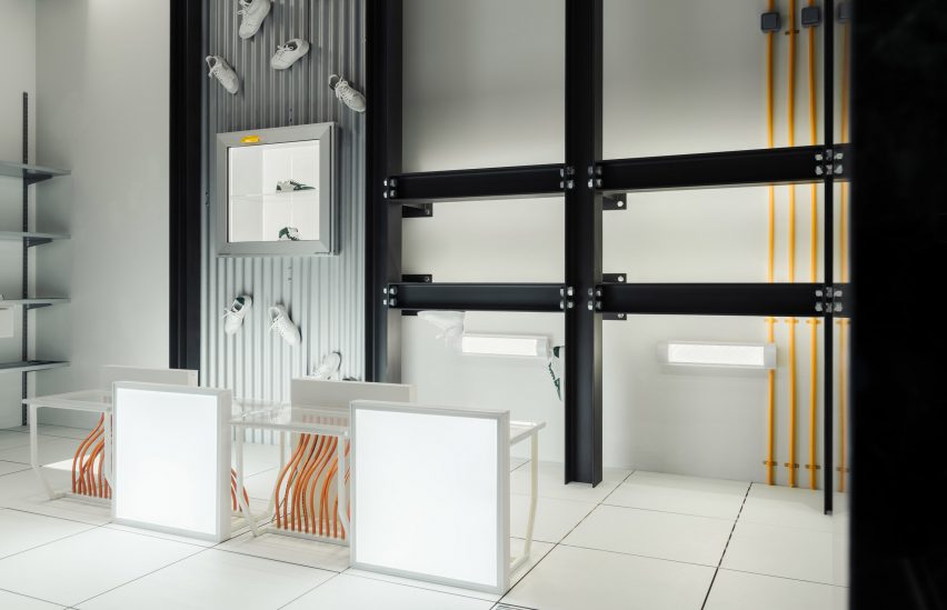 Interior image of the Axel Arigato store with exposed structural elements